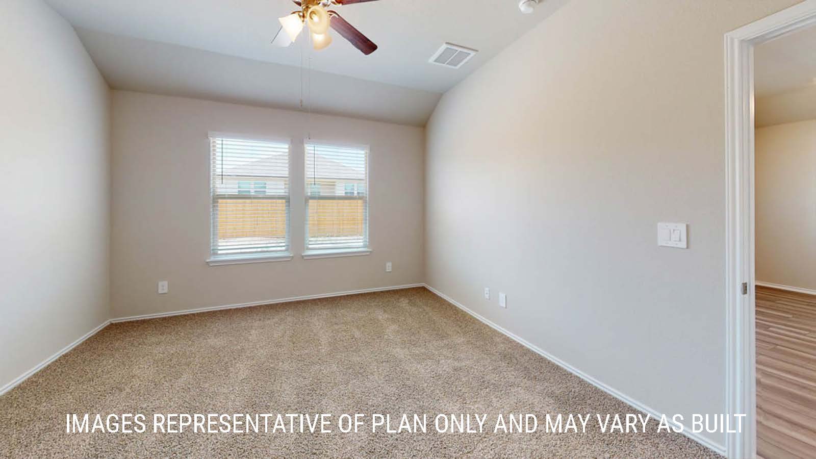 Elgin secondary bedroom with windows and carpeted flooring.