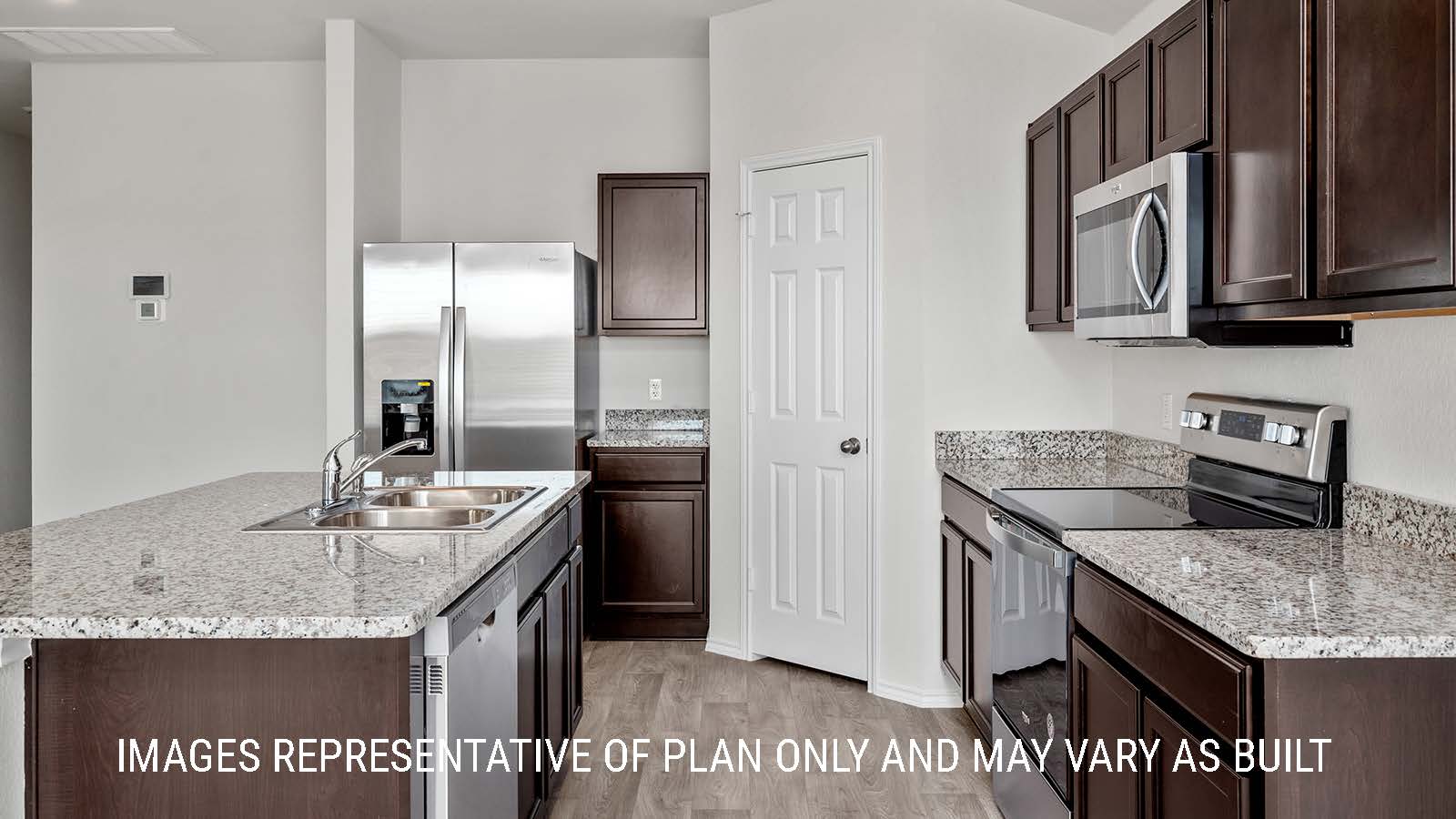 Fargo kitchen with granite countertops and dark cabinets.