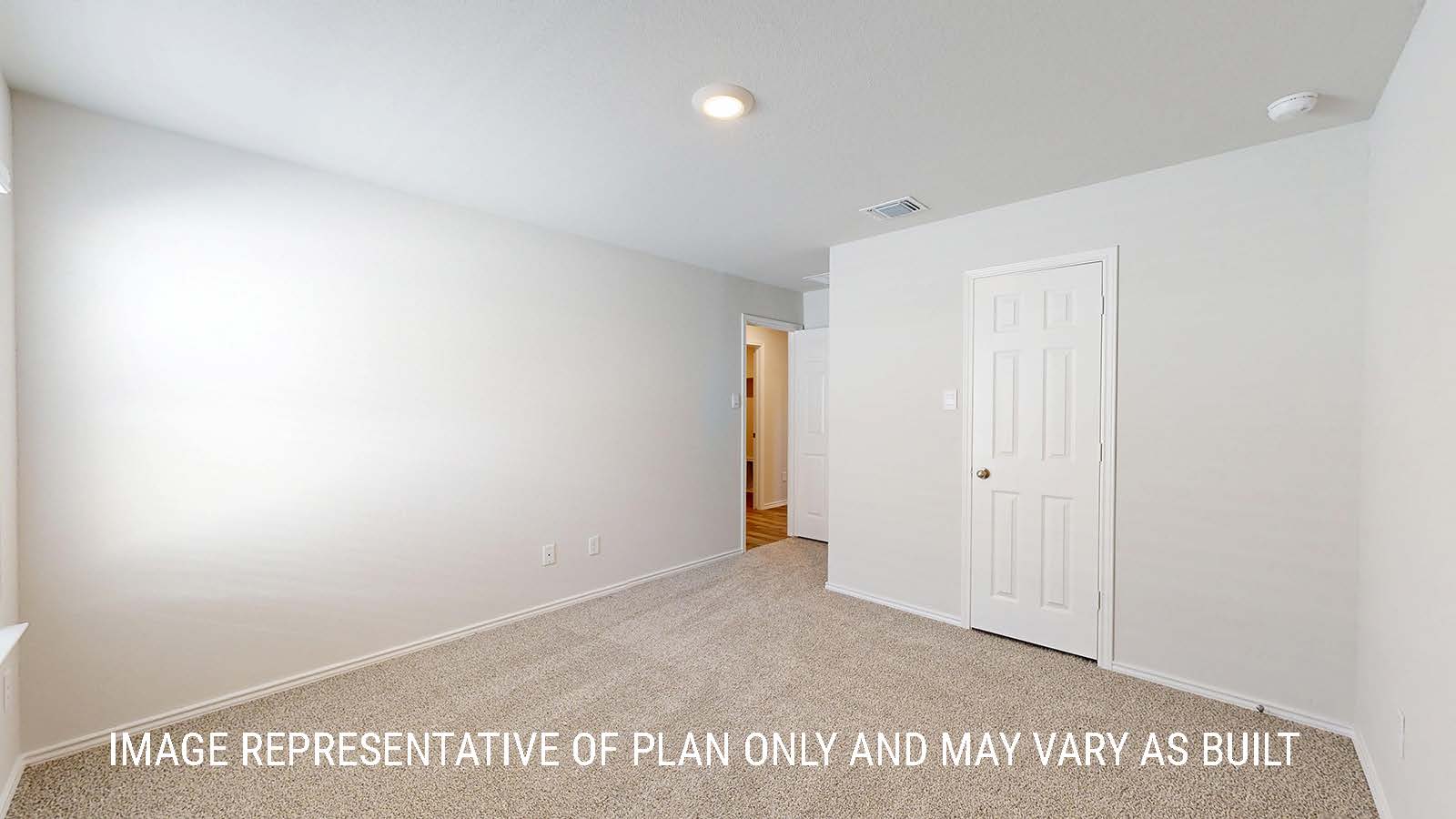 Seabrook secondary bedroom with carpeted flooring and closet door.