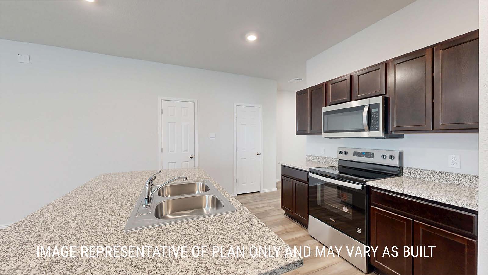 Seabrook kitchen with dark cabinets and granite countertops.