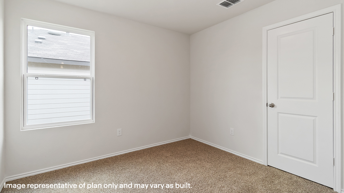 Atlanta secondary bedroom with carpeted flooring and window.