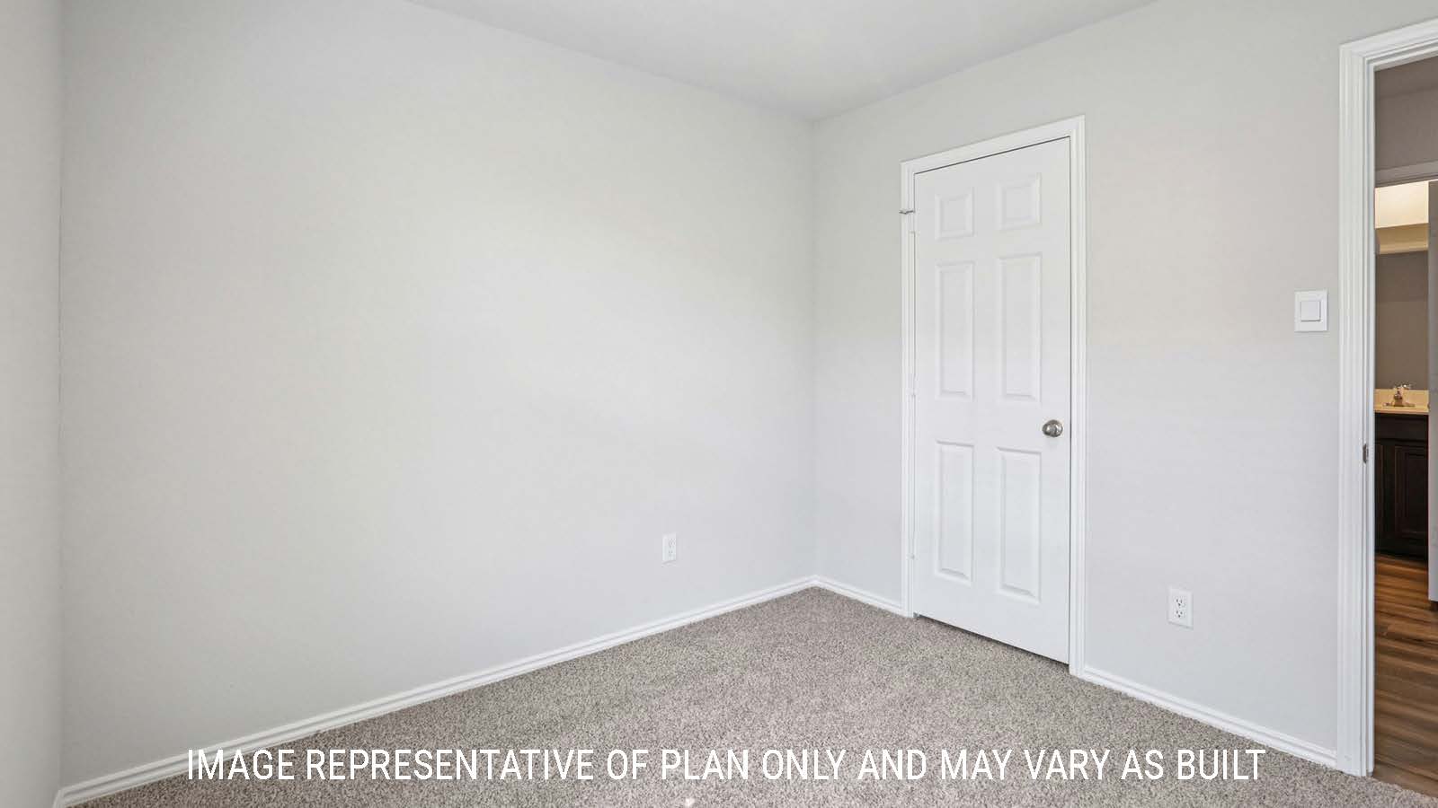 Atlanta secondary bedroom with carpeted flooring and view of hallway.