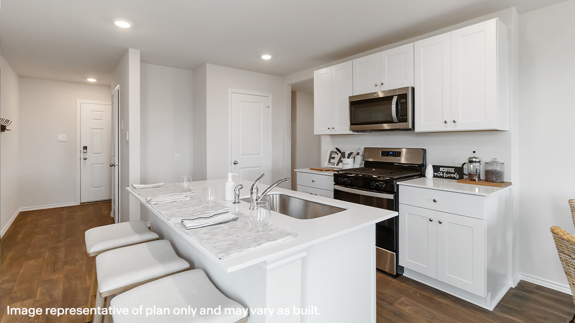 Atlanta kitchen with white cabinets and view of front entry.