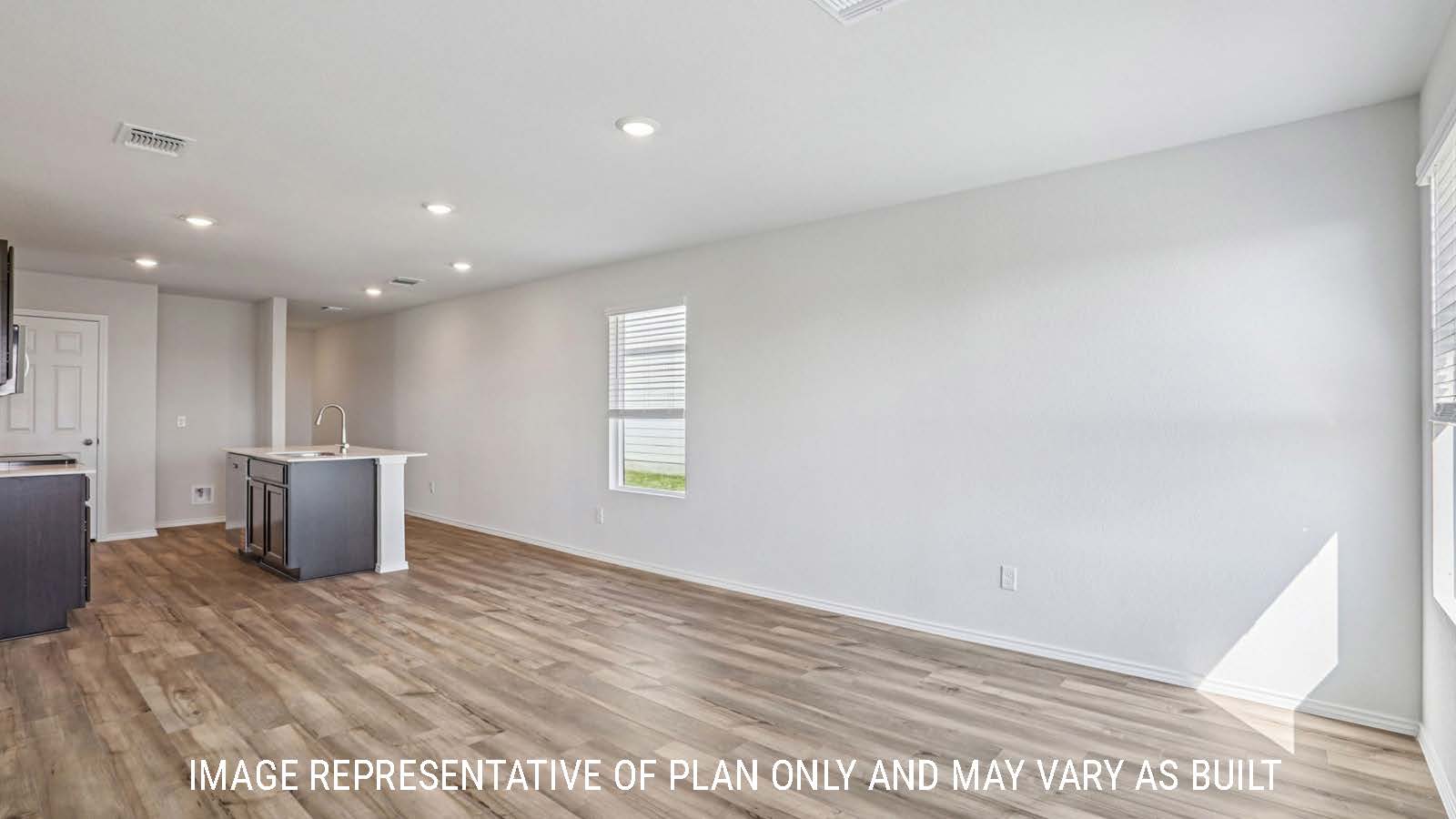 Atlanta dining room with vinyl plank flooring and view of open concept kitchen.