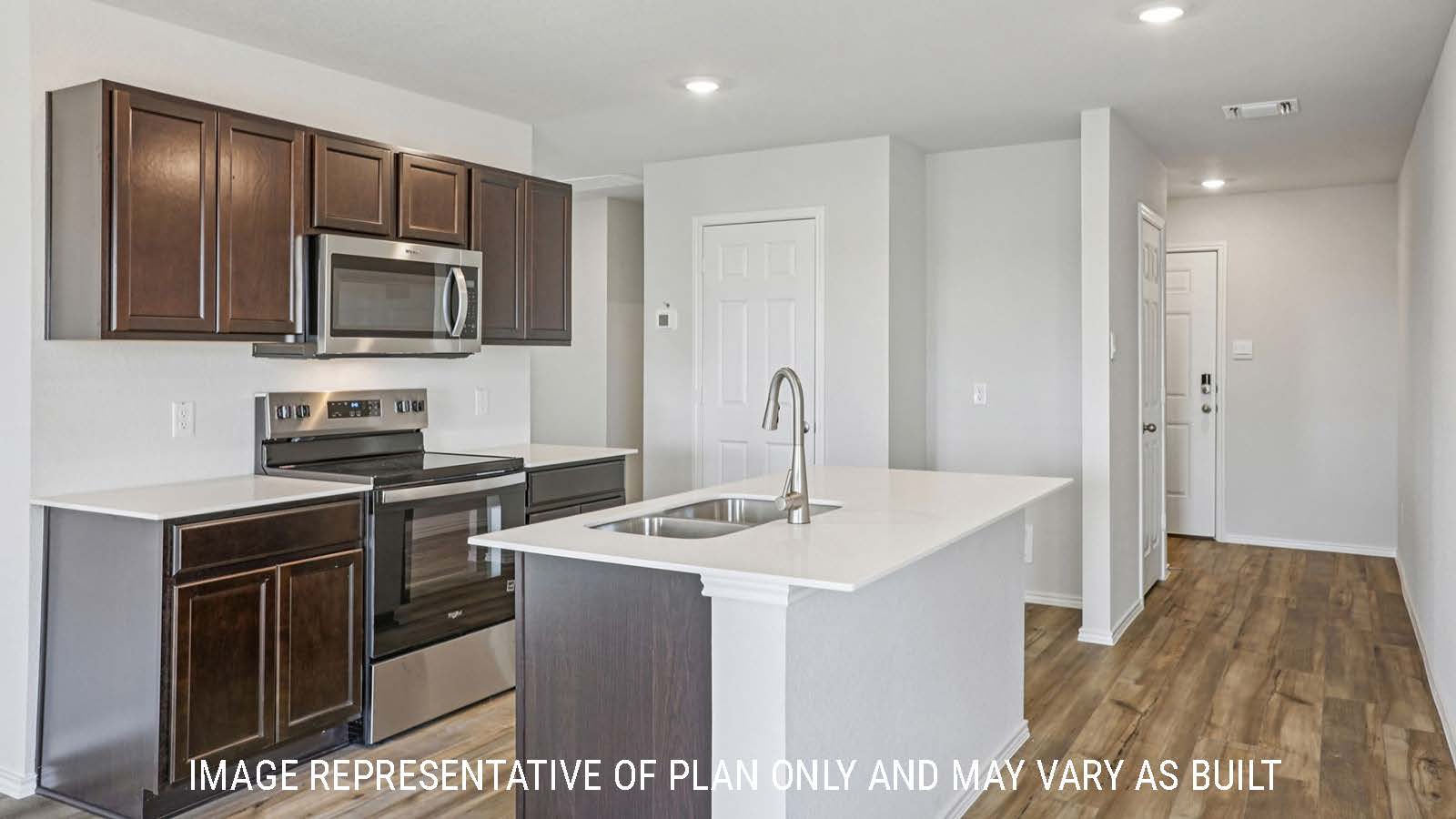 Atlanta kitchen with center kitchen island with granite countertops and view of front entry way.