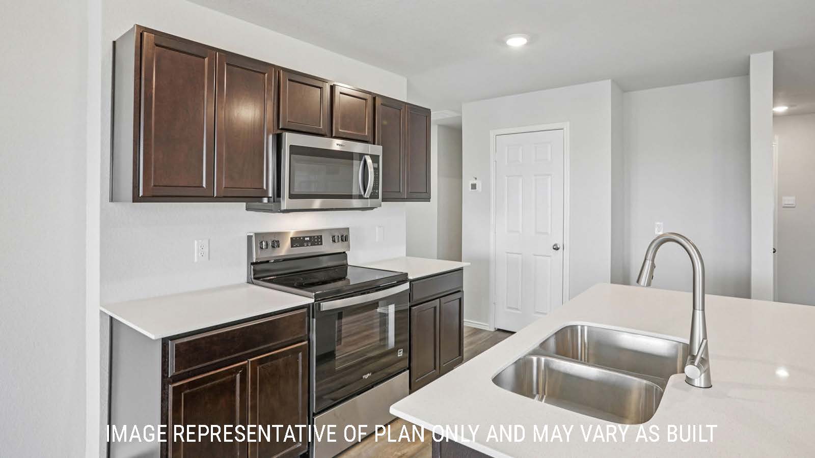 Atlanta kitchen with kitchen island with granite countertops and dark cabinets.