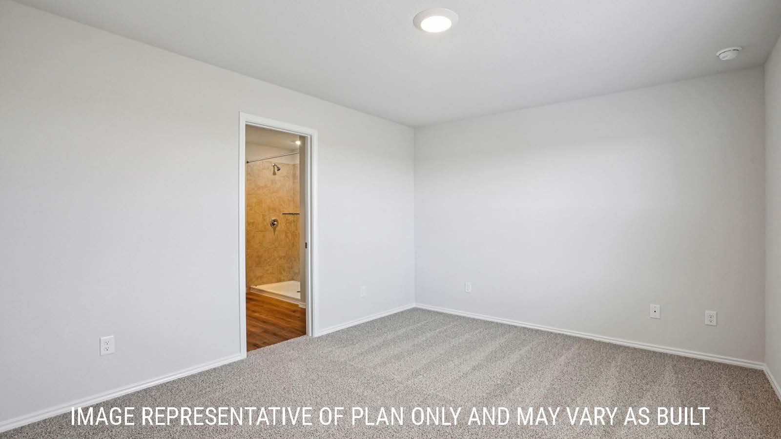 Barton primary bedroom with carpeted flooring and view of primary bathroom.