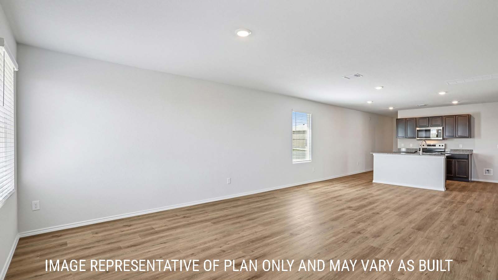 Barton dining room with vinyl plank flooring and view of open concept kitchen.