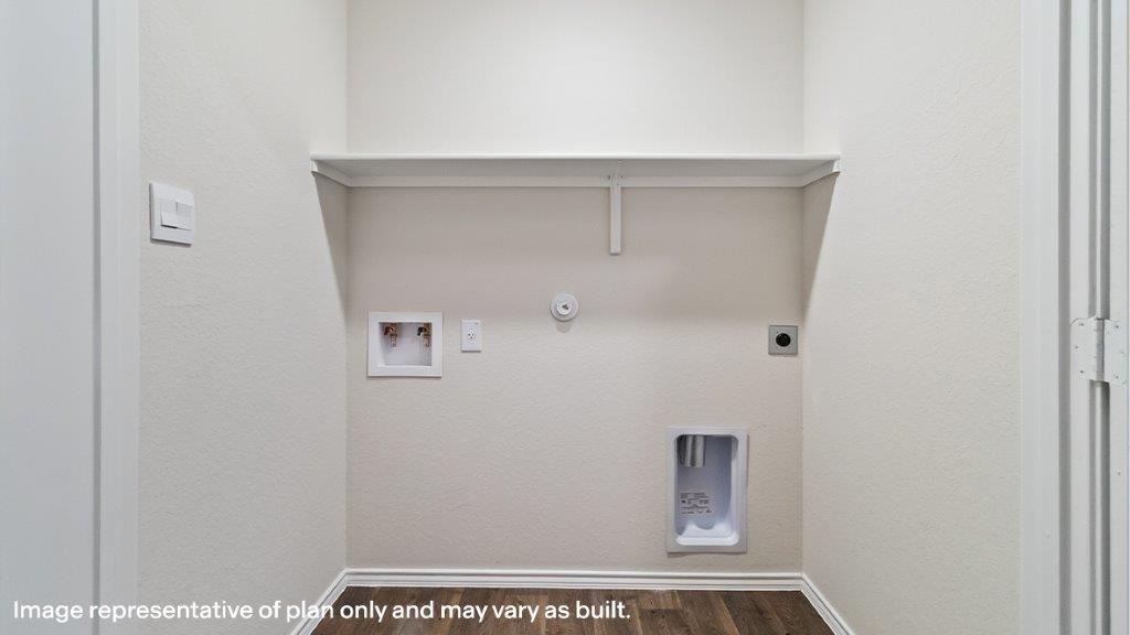 Barton utility room with washer and dryer connections and shelving.