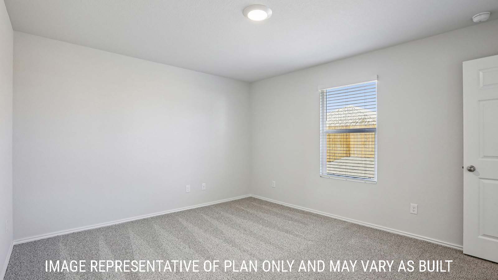 Caprock primary bedroom with carpeted flooring and window for natural lighting.