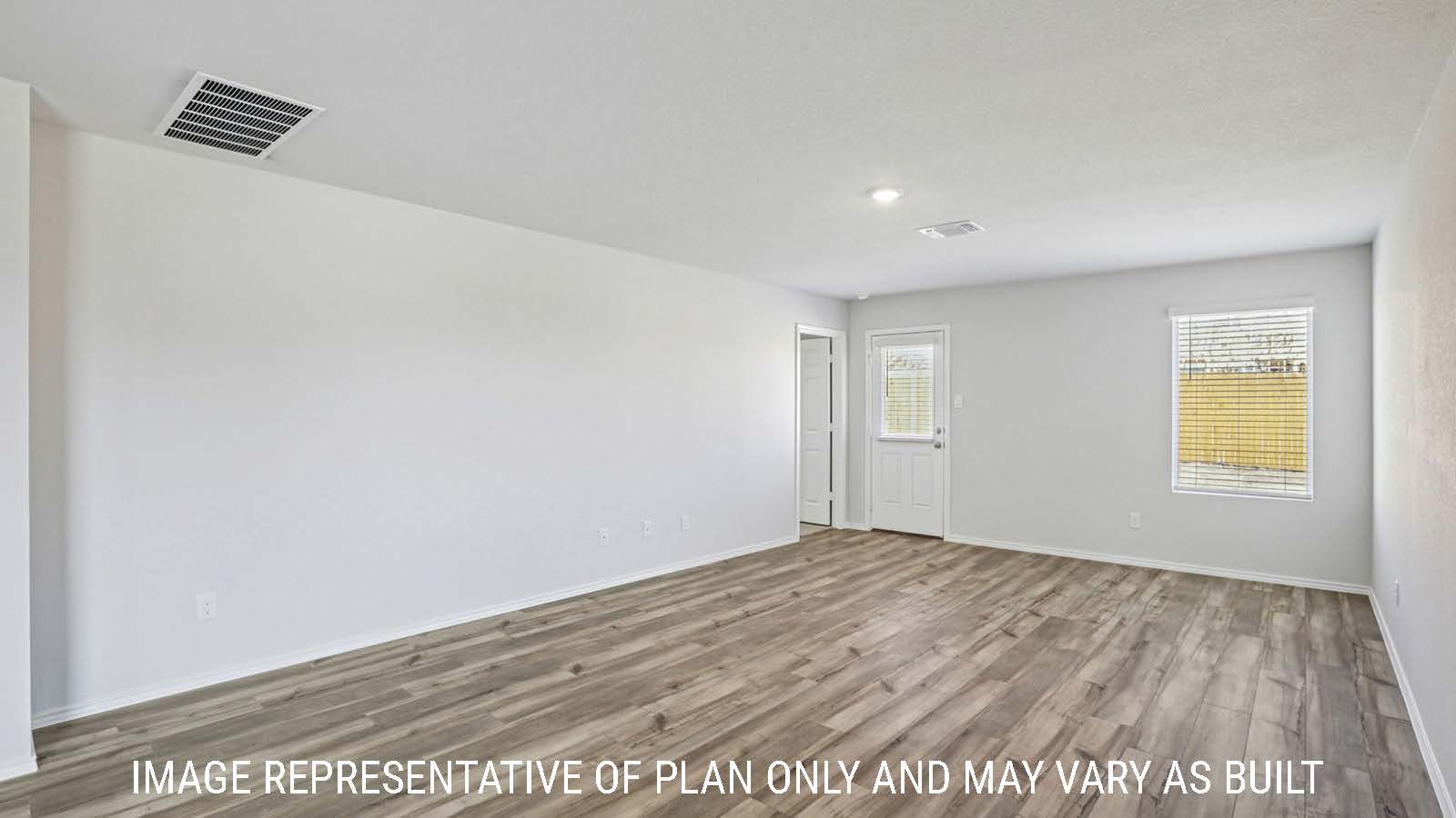 Caprock living room with view of back door and windows for natural lighting.