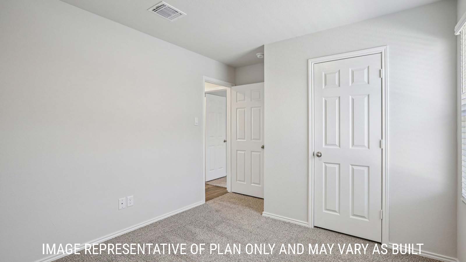 Caprock secondary bedroom with carpeted flooring and view of hallway.