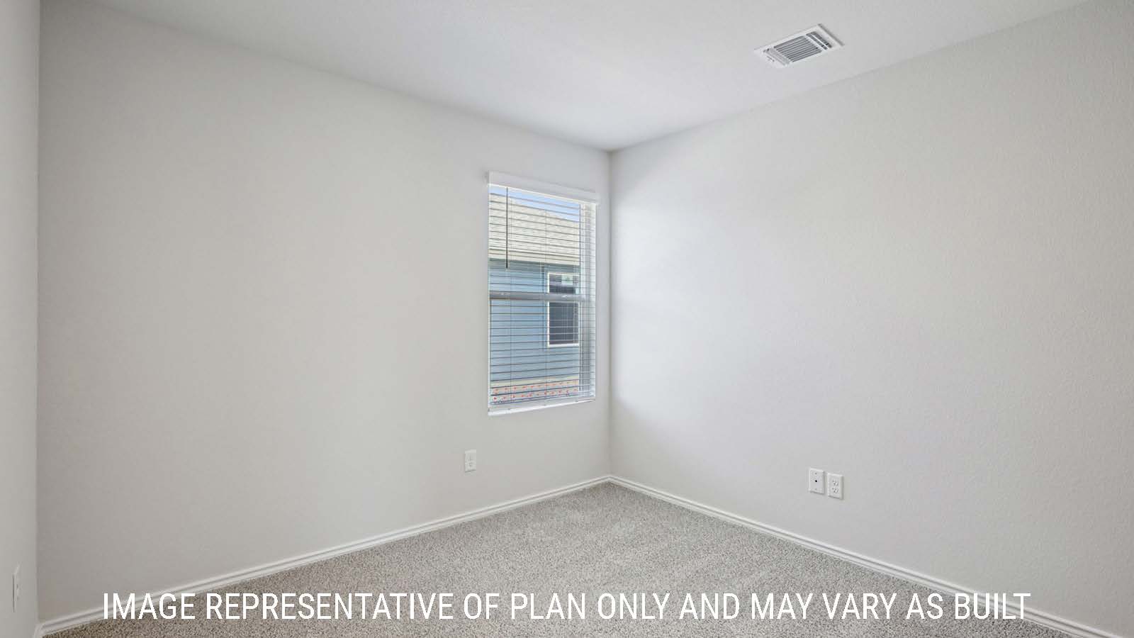 Caprock secondary bedroom with carpeted flooring and window for natural lighting.