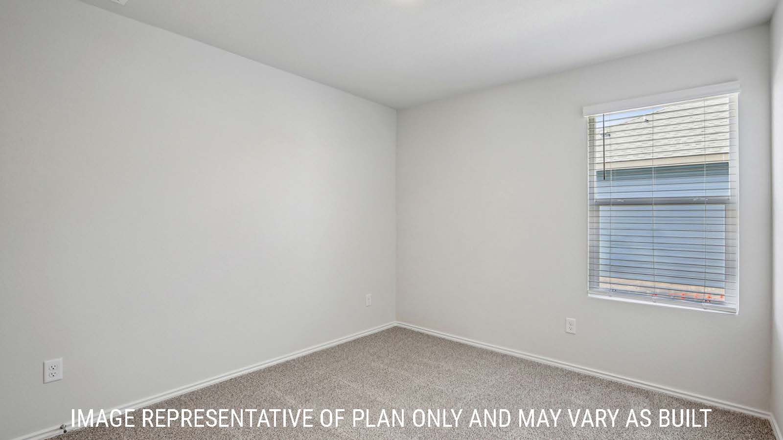 Caprock secondary bedroom with carpeted flooring and window for natural lighting.