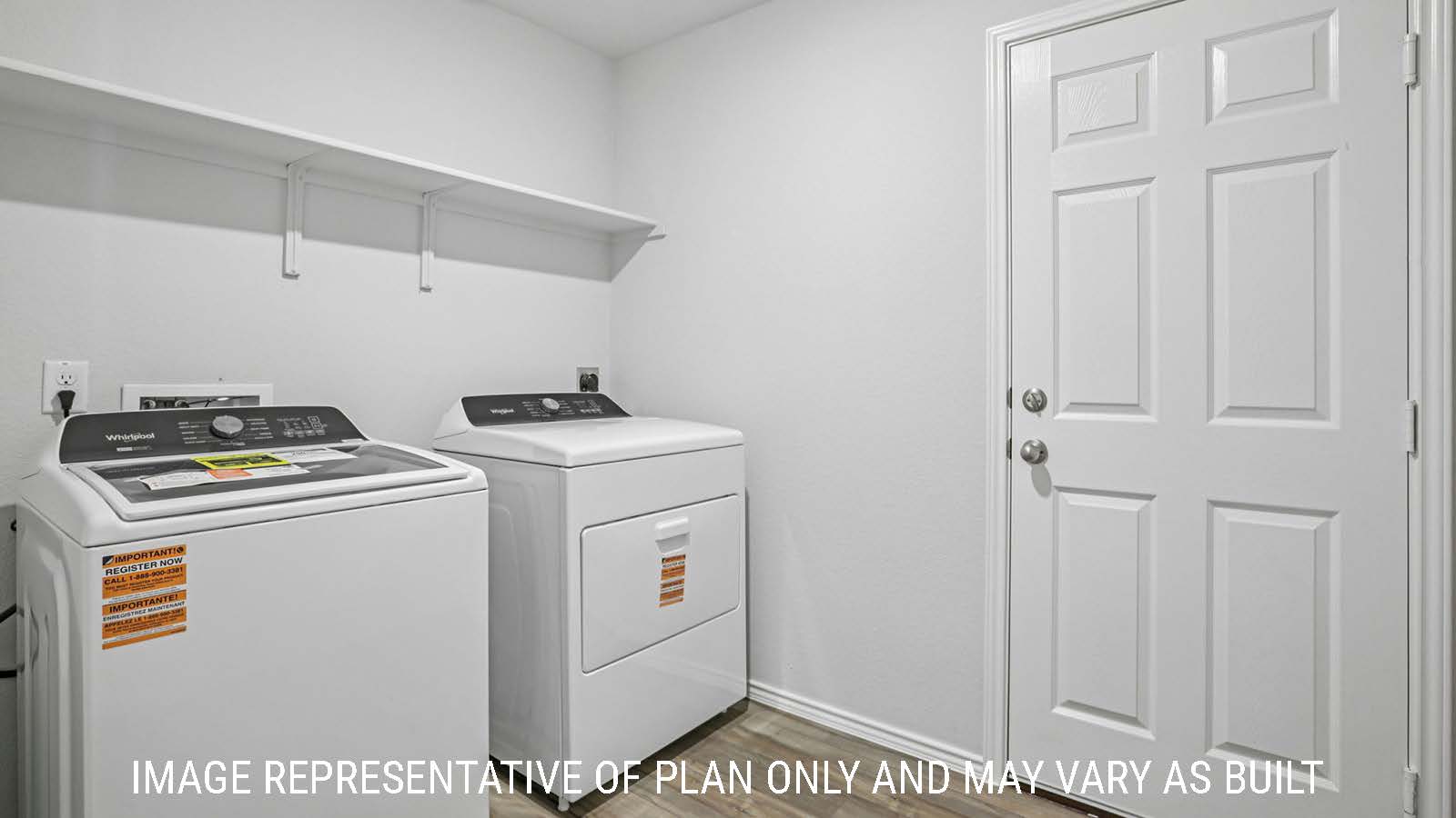 Caprock utility room with washer and dryer and shelving for storage.