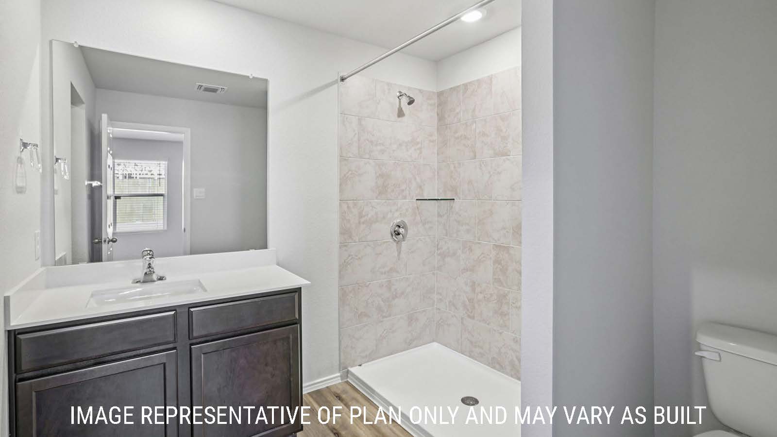 Caprock primary bathroom with vanity sink and walk-in shower.