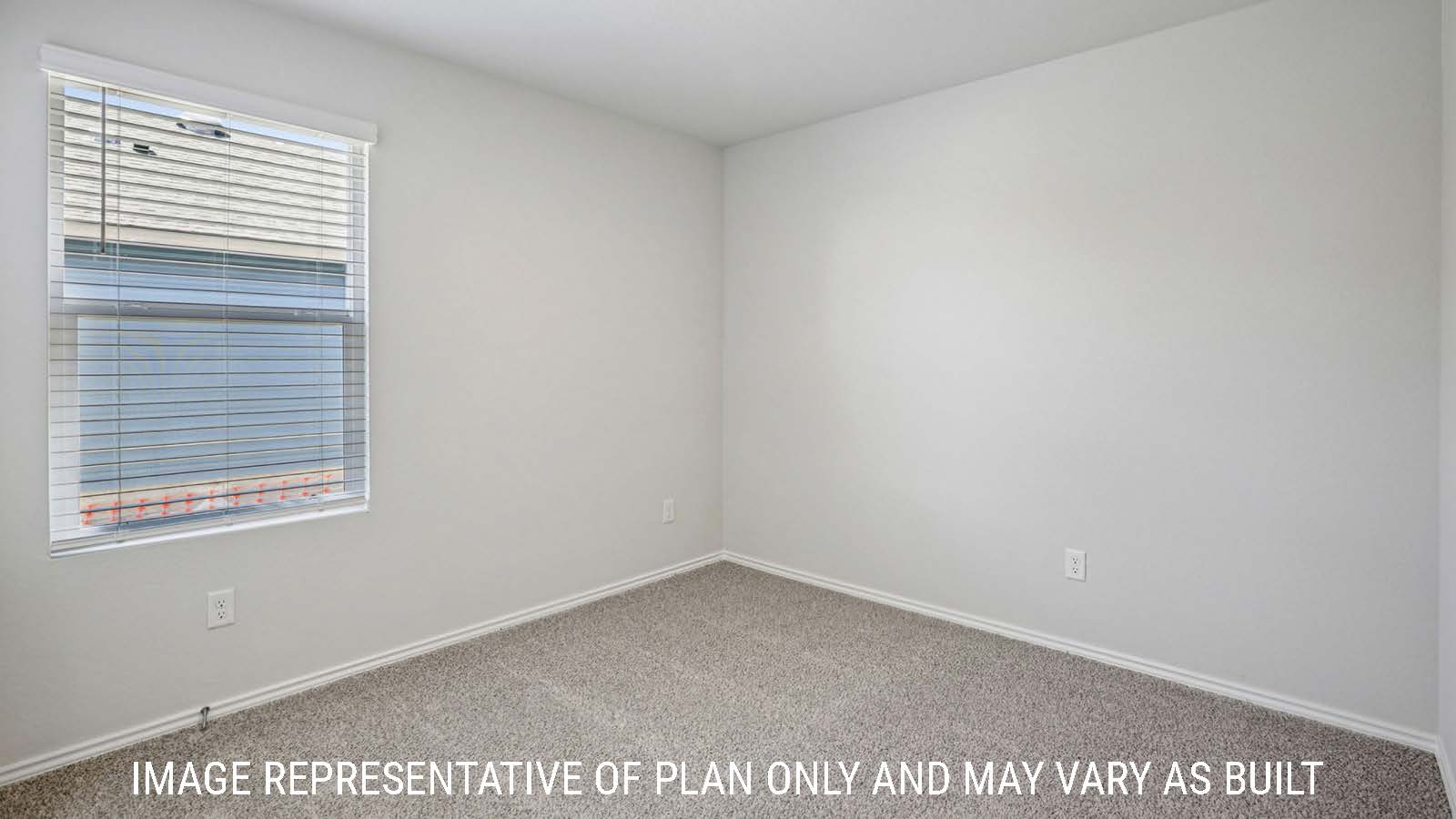 Caprock secondary bedroom with carpeted flooring and window for natural lighting.