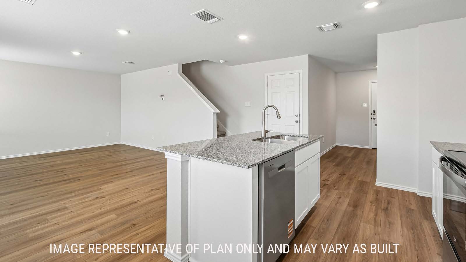 Davis kitchen with kitchen island and view of front entry way.