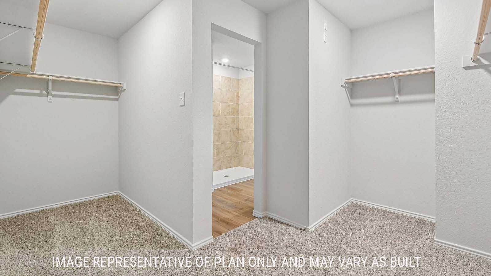 Davis secondary bedroom with carpeted flooring and view of hallway.