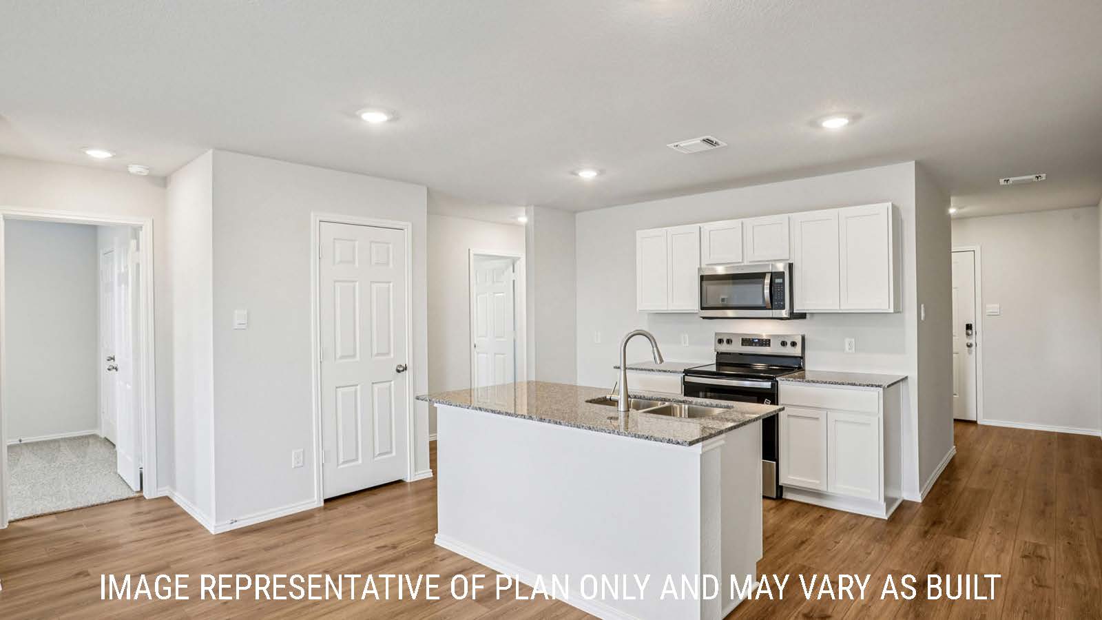 Estero kitchen with kitchen island with granite countertops and view of entry way.