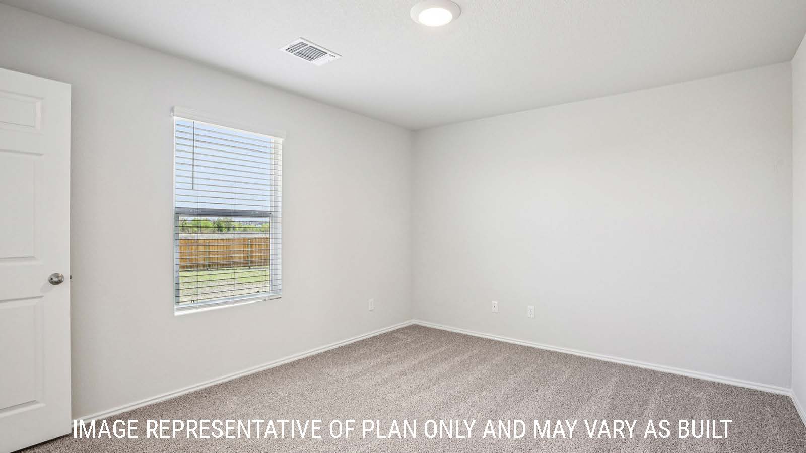Estero primary bedroom with carpeted flooring and window for natural lighting.