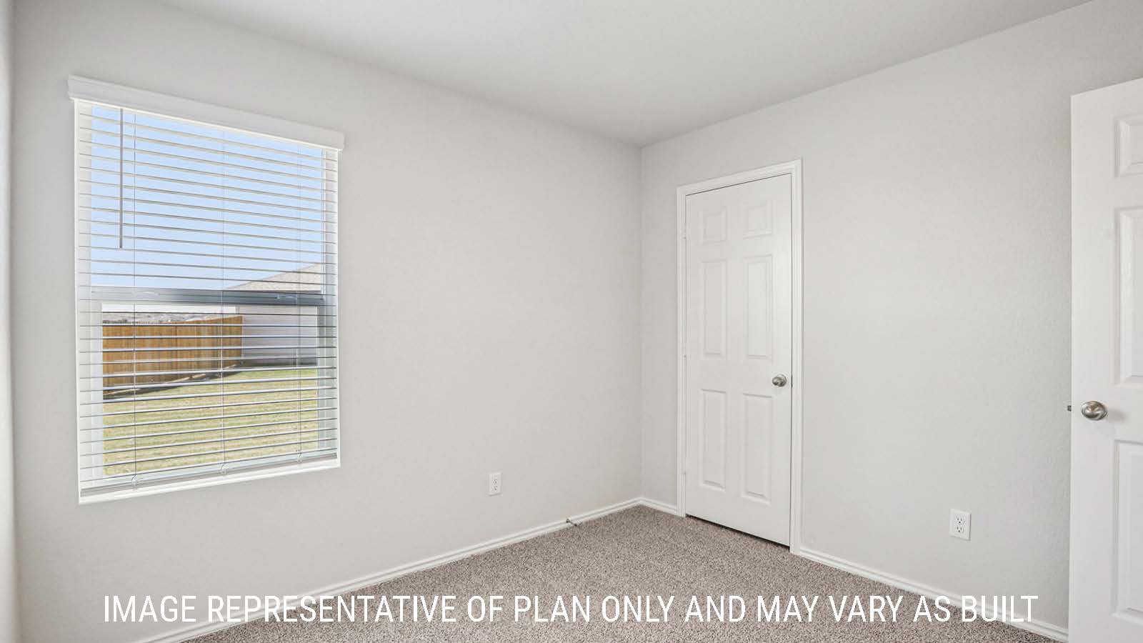 Estero secondary bedroom with carpeted flooring and window for natural lighting.