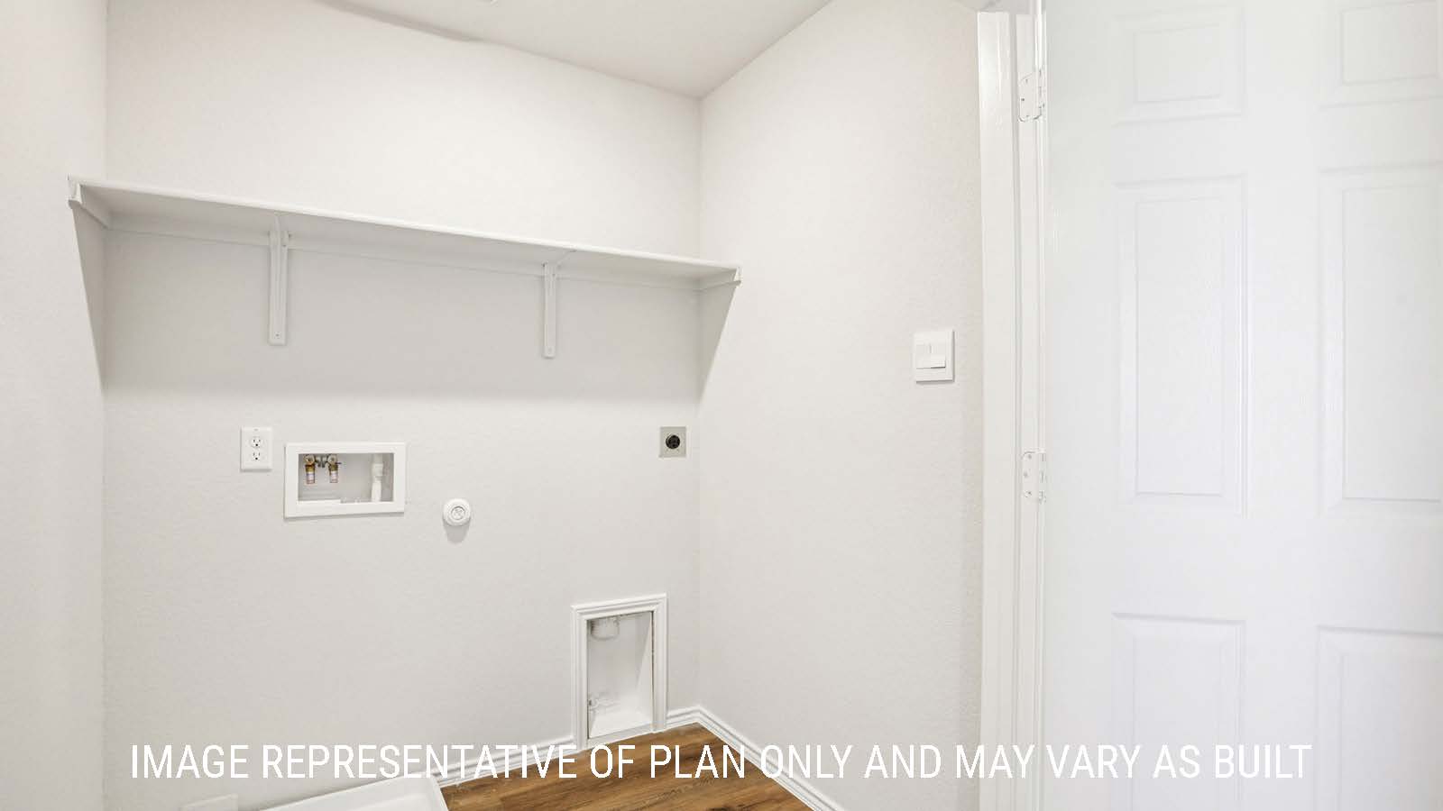 Franklin utility room with washer and dryer connections and shelving for storage.