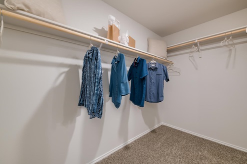 Willow Glenn model home primary closet with spacious room.