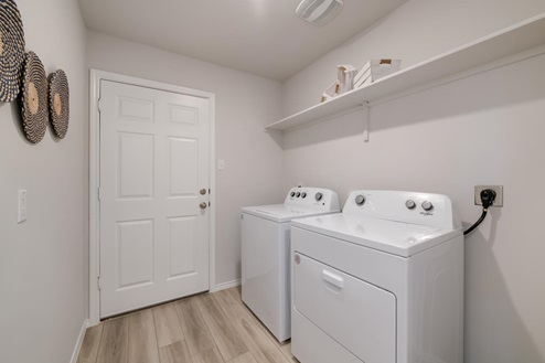 Willow Glenn model home utility room with washer and dryer.