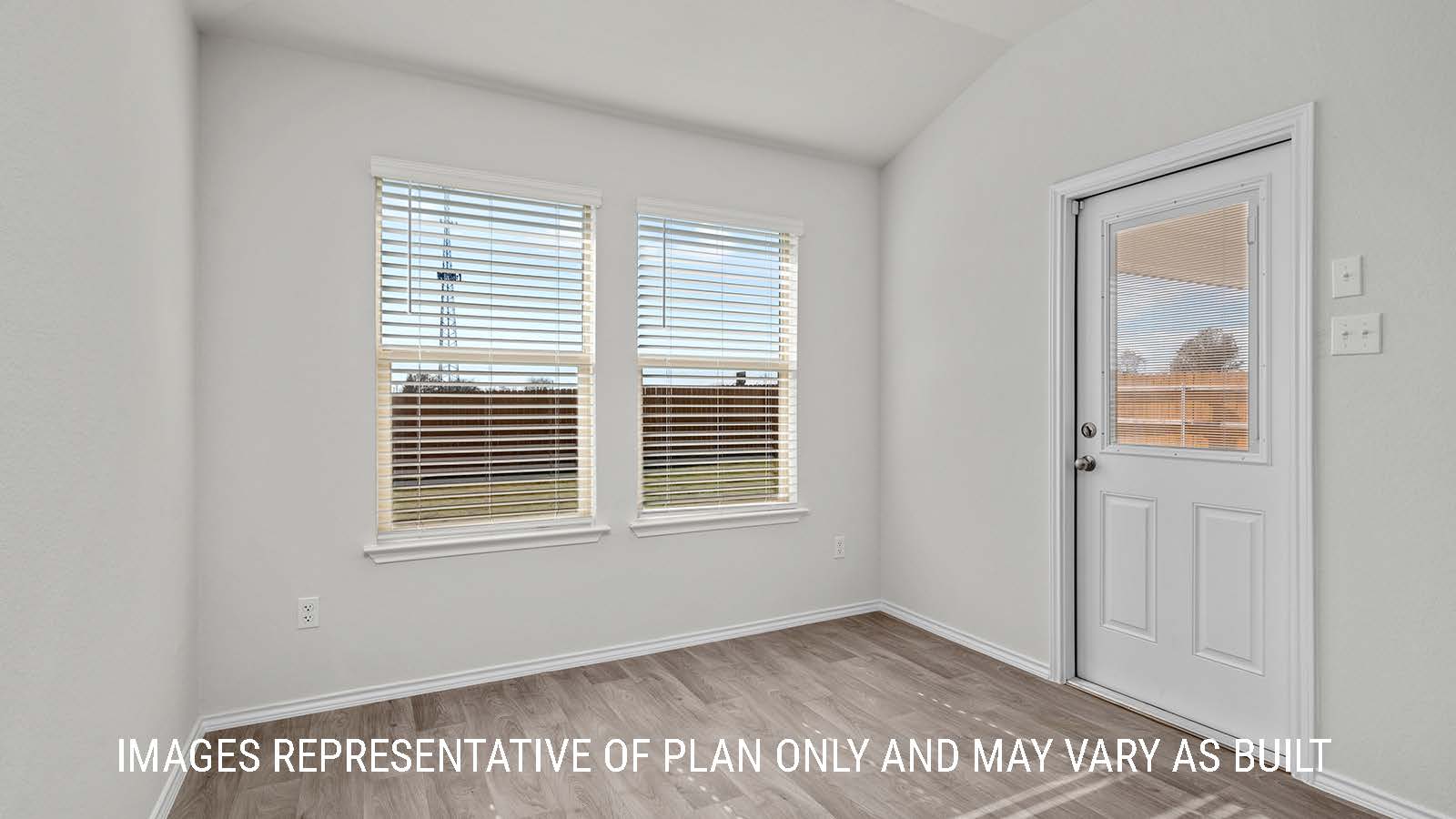 Fargo dining room with windows and view of the backyard.