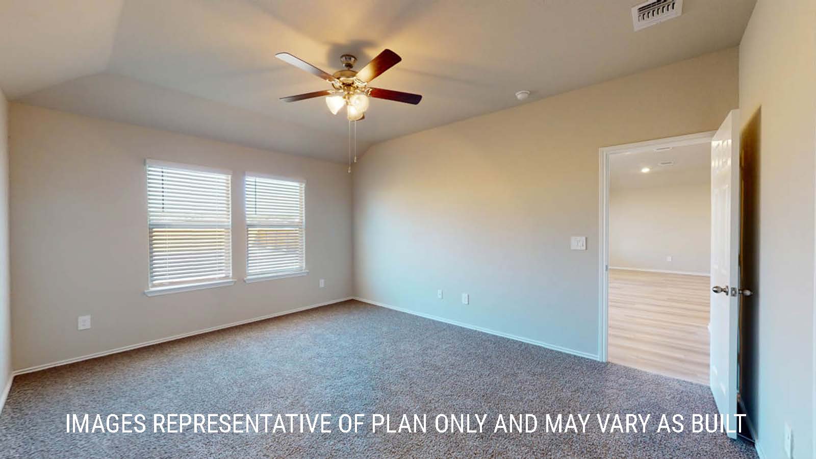 Texas Cali primary bedroom with windows and carpeted flooring.
