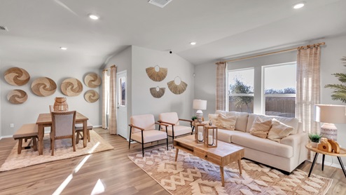 Pecan Creek model home living room with a view of the dining room.