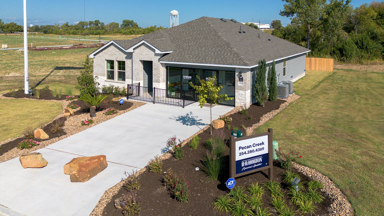 Pecan Creek Model Front Exterior Texas Cali Elevation with glass doors.