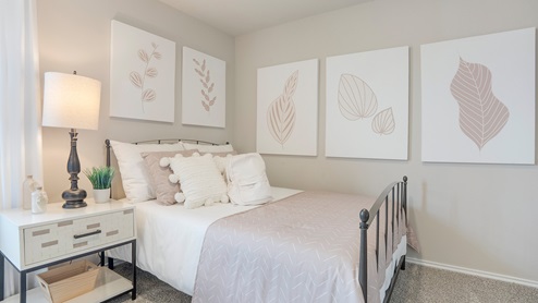 Pecan Creek Model Texas Cali secondary bedroom with carpeted flooring.