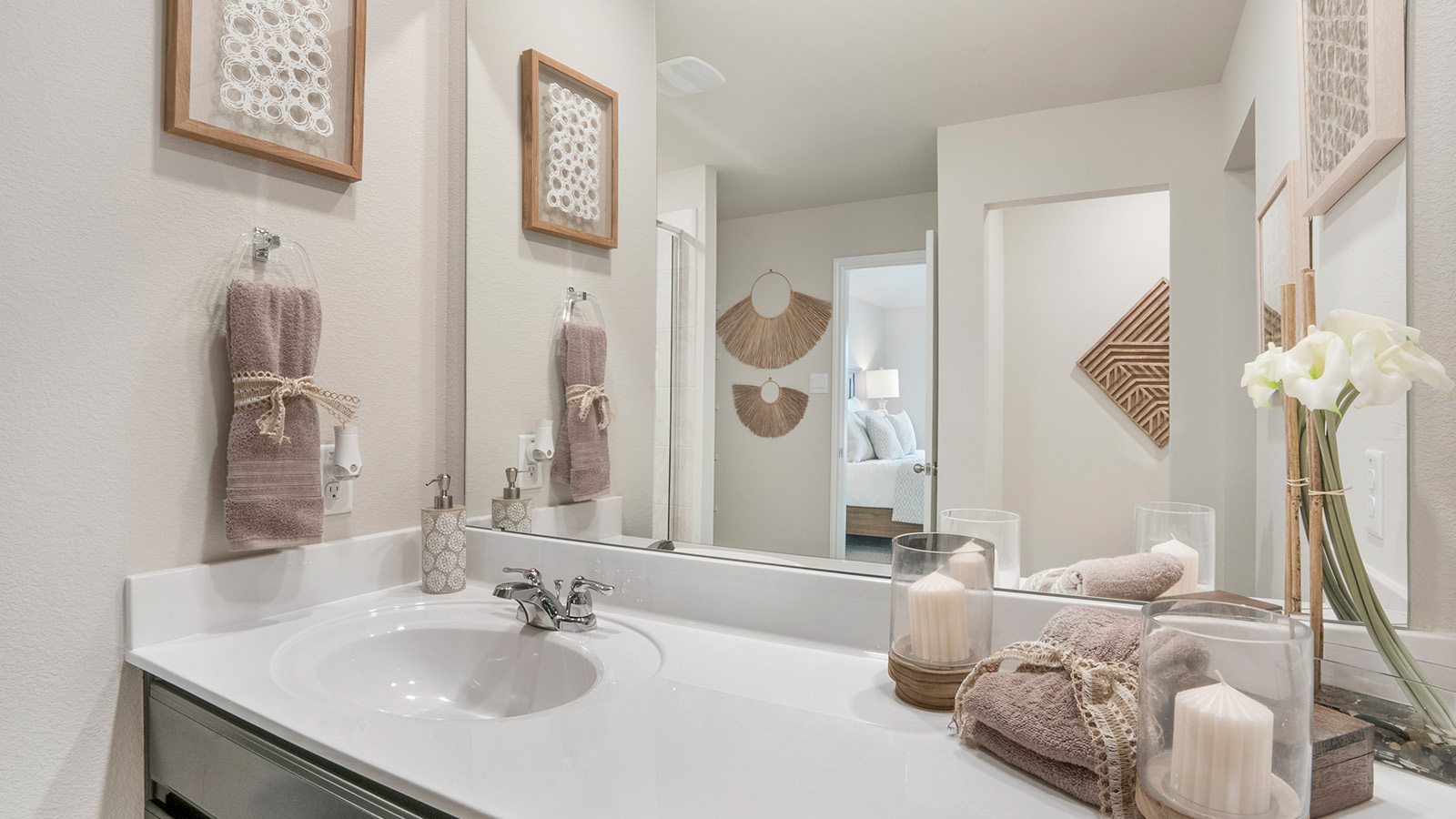 Pecan Creek Model Texas Cali primary bathroom with vanity and granite countertop.