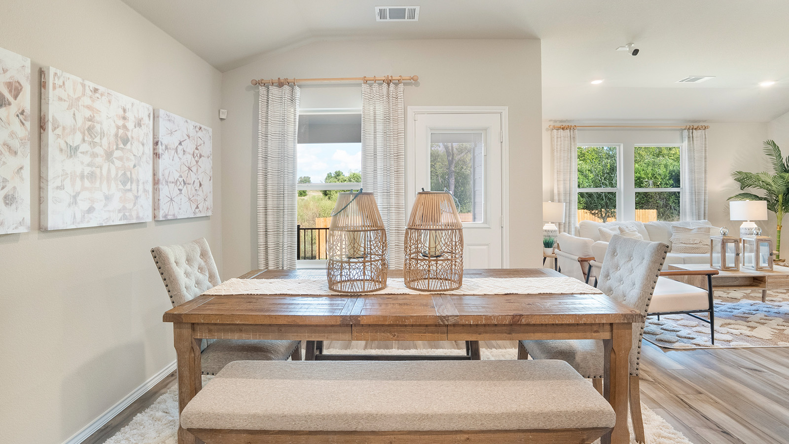 Pecan Creek Model Texas Cali dining room with view of back door and window to the back yard.