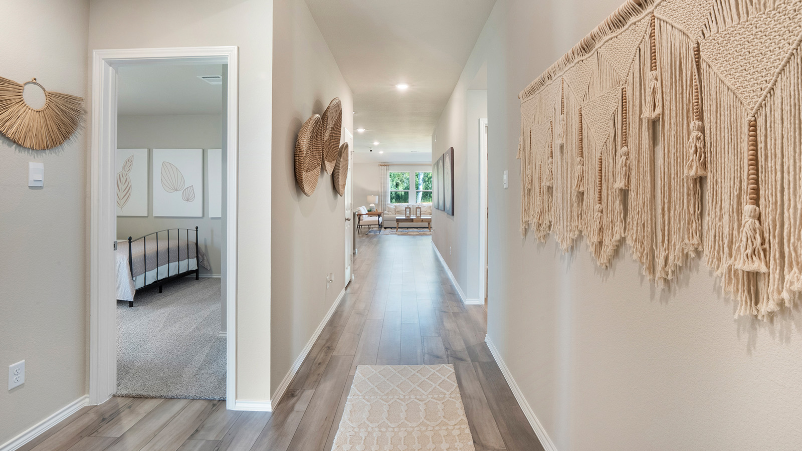 Pecan Creek Model Texas Cail front entrance with view of secondary bedroom and living room.