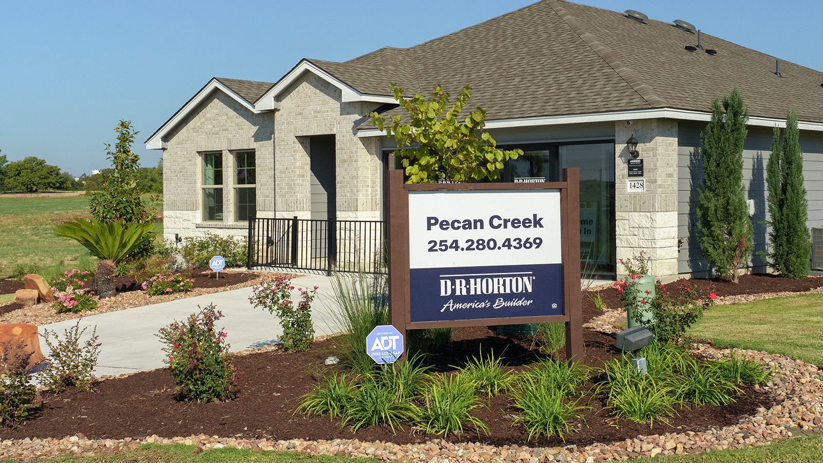 Pecan Creek Model Front Exterior Texas Cali Elevation with glass doors.