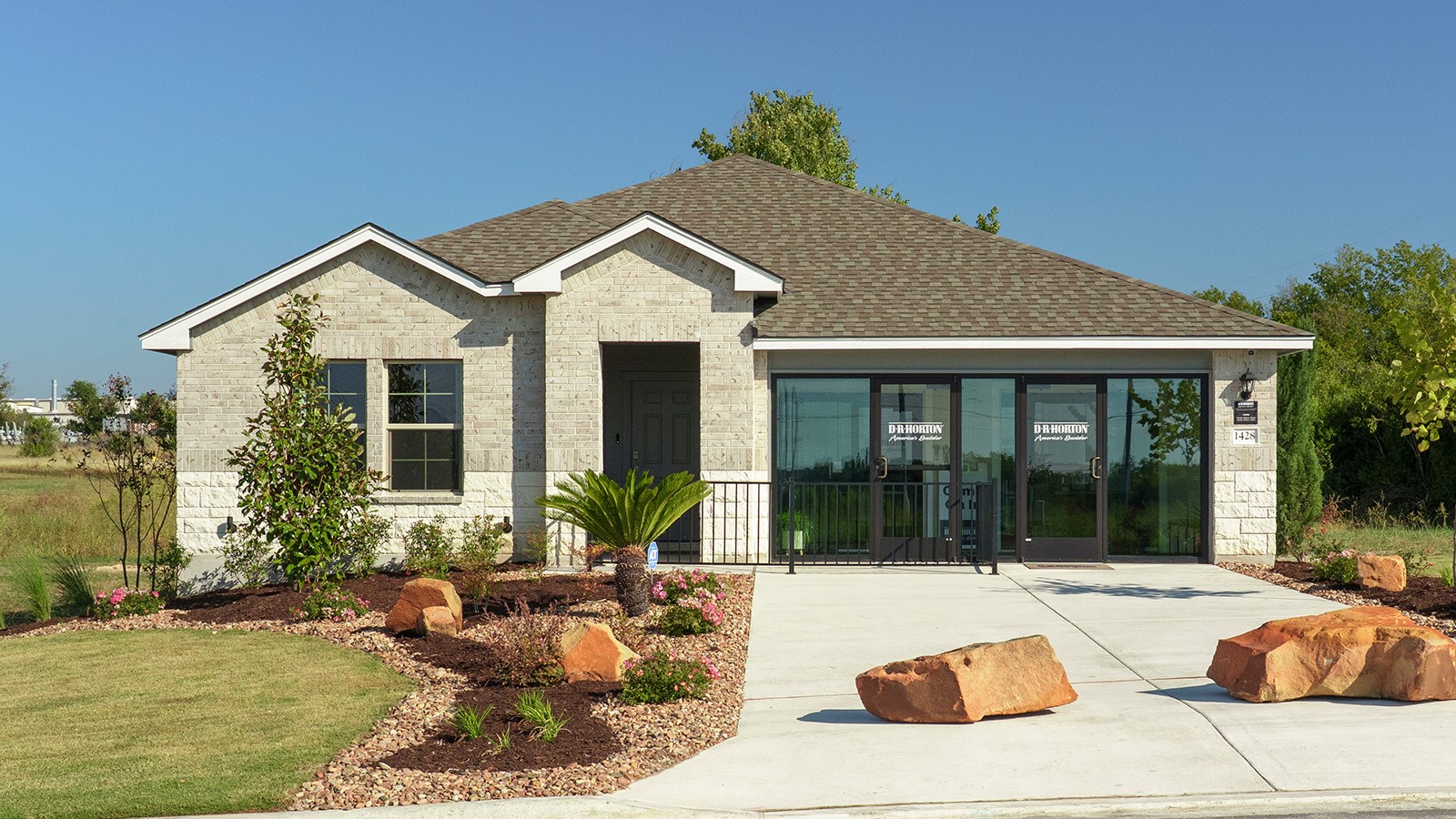 Pecan Creek Model Front Exterior Texas Cali Elevation with glass doors.