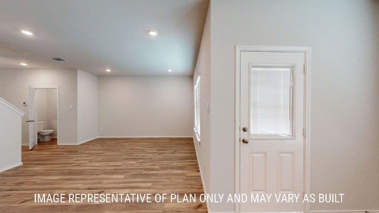 Emma dining room with view of open concept kitchen and living room.