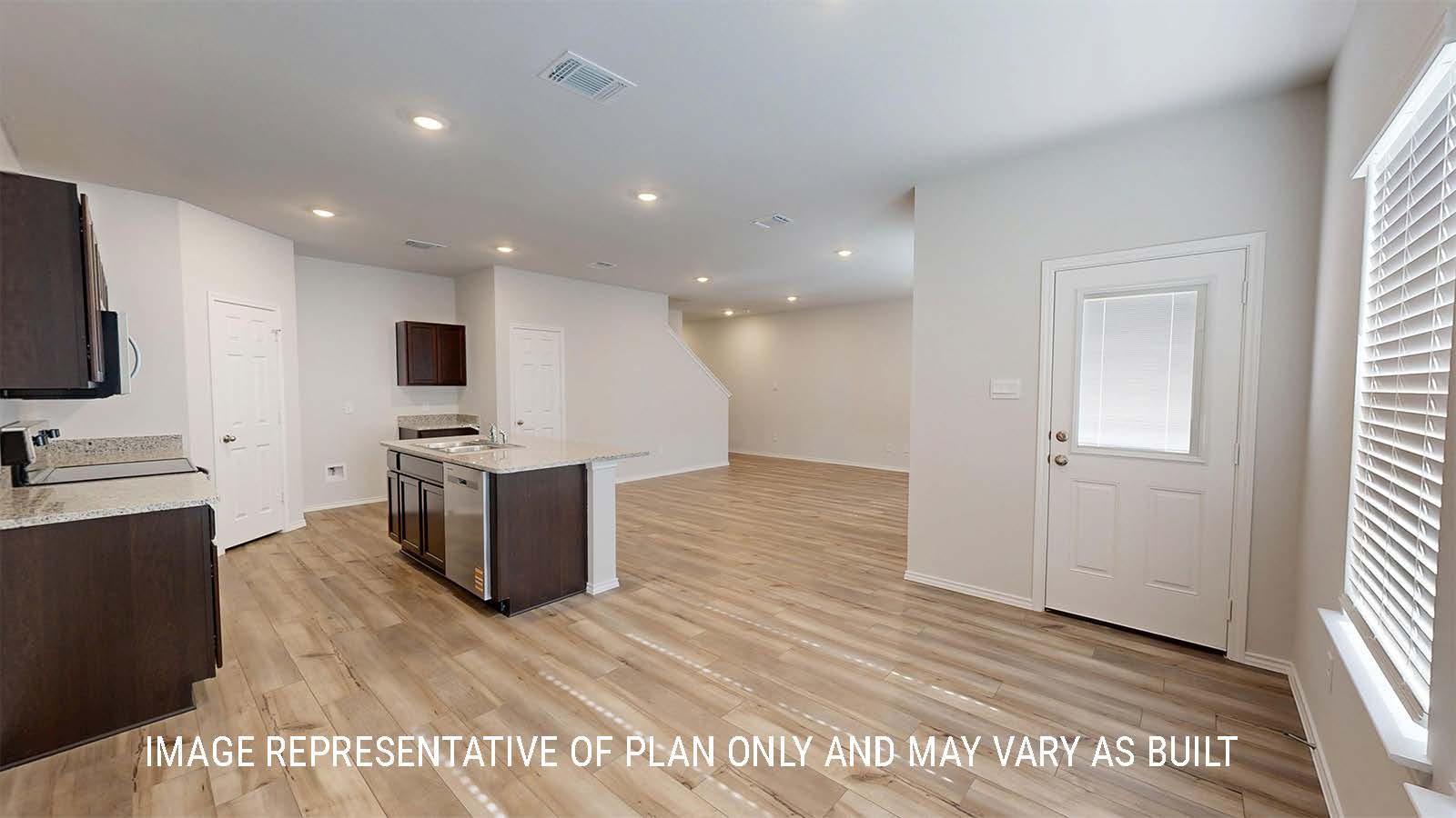 Grace dining room with view of living room and back door.