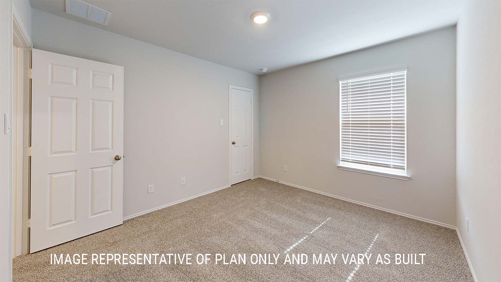Grace secondary bedroom with carpeted flooring and window for lighting.