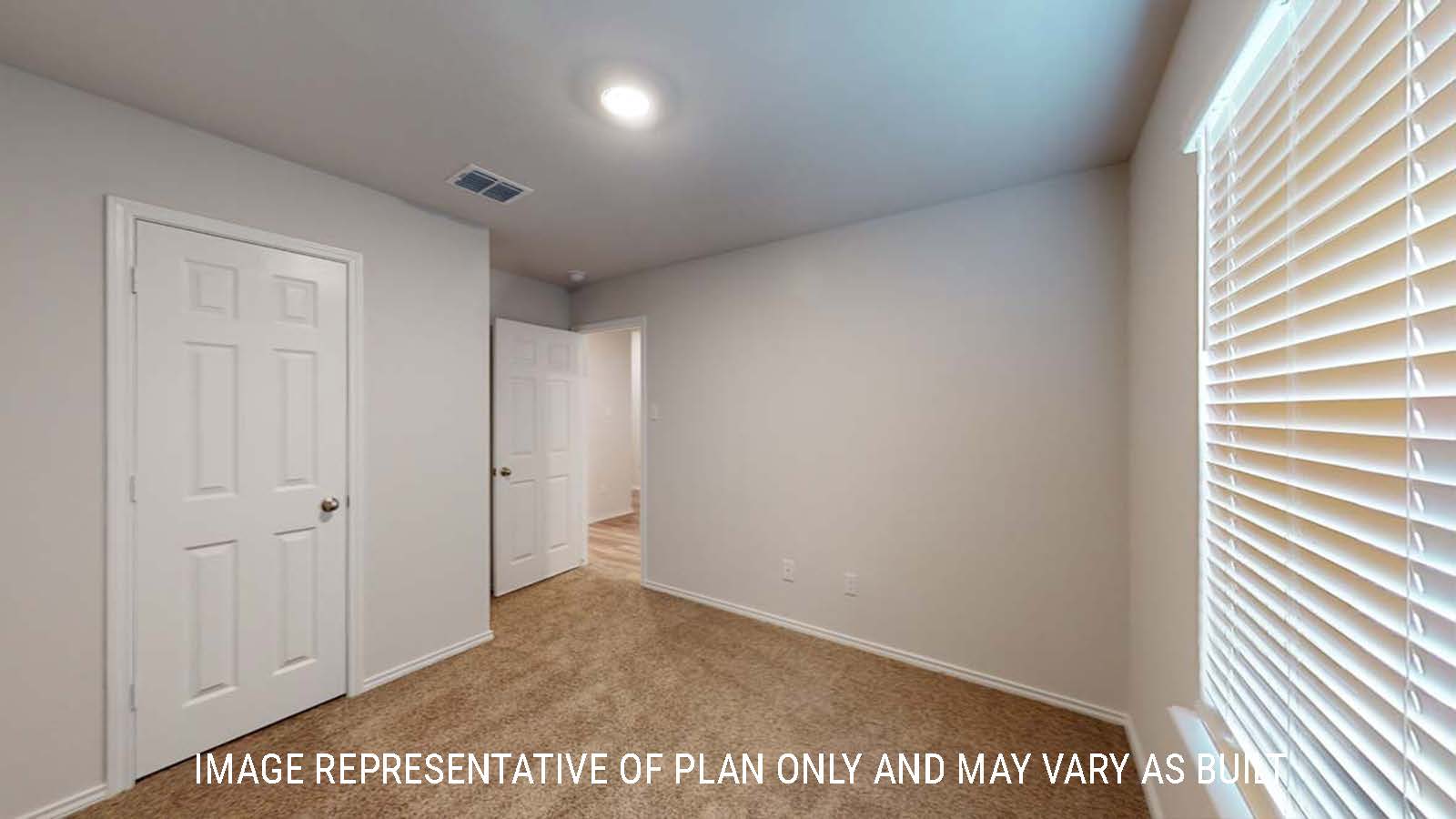 Ashburn secondary bedroom with window and carpeted flooring.