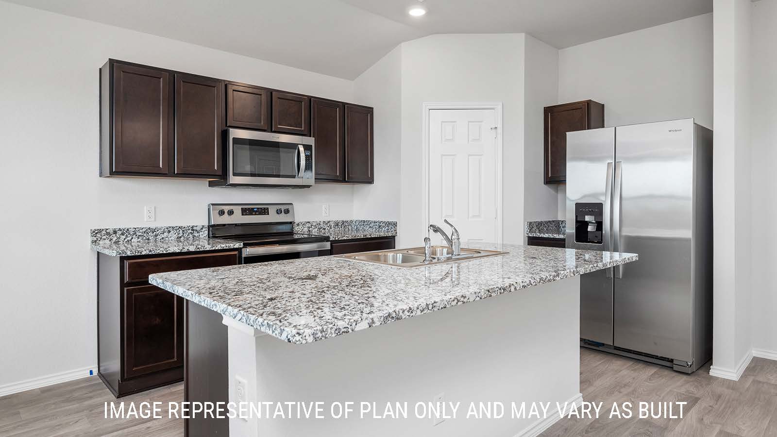 Ashburn kitchen with center kitchen island with granite countertops and dark cabinets.