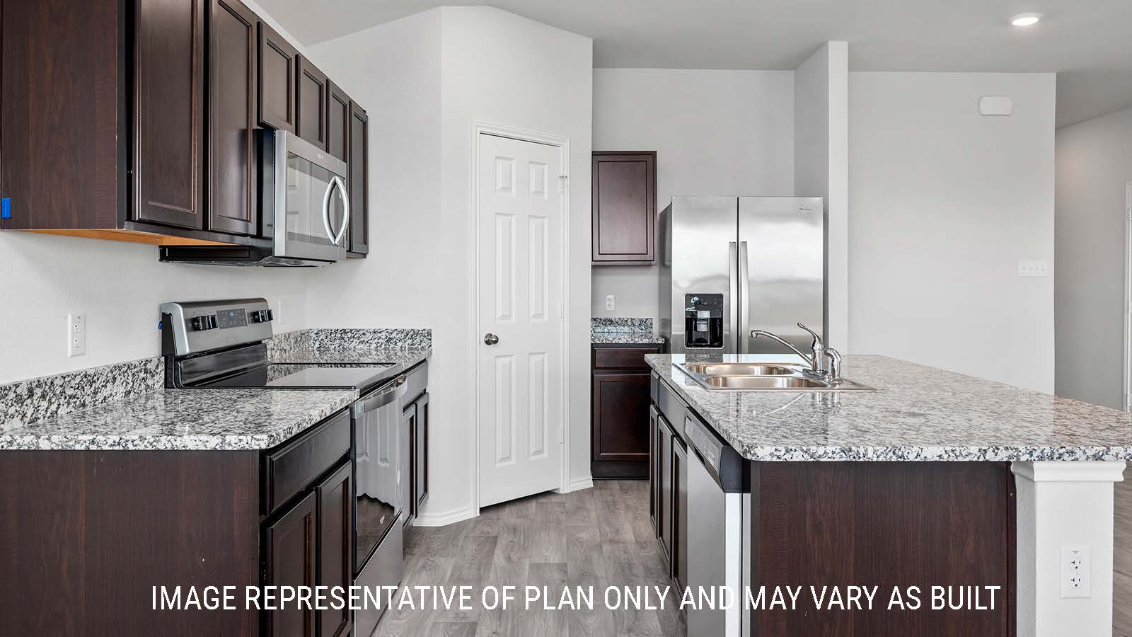 Ashburn kitchen with center kitchen island with granite countertops and dark cabinets.