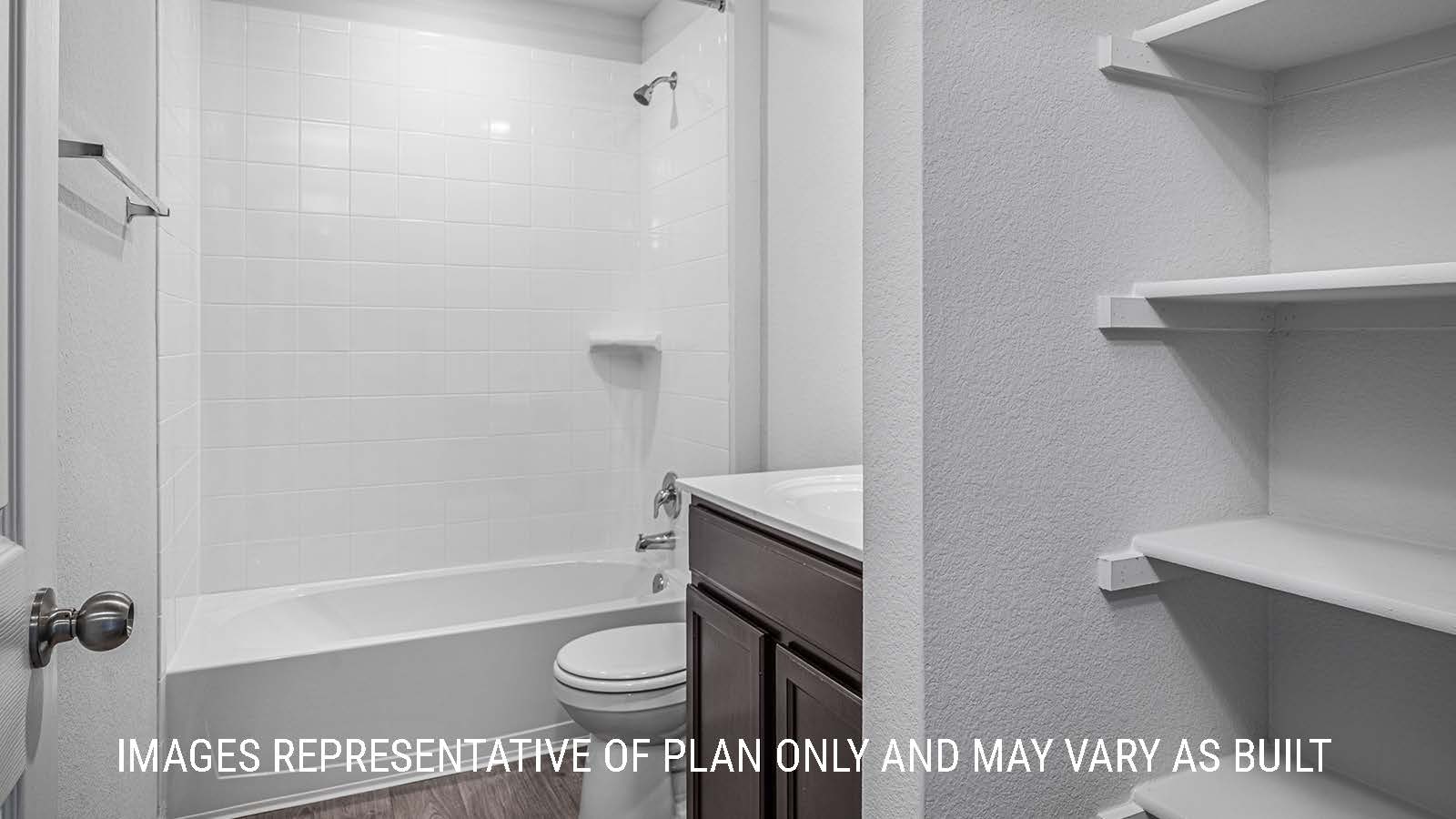 Elgin secondary bathroom with single vanity sink and shower and tub combo.