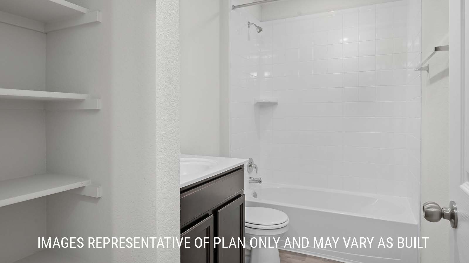 Texas Cali secondary bathroom with single vanity and shower and tub combo.