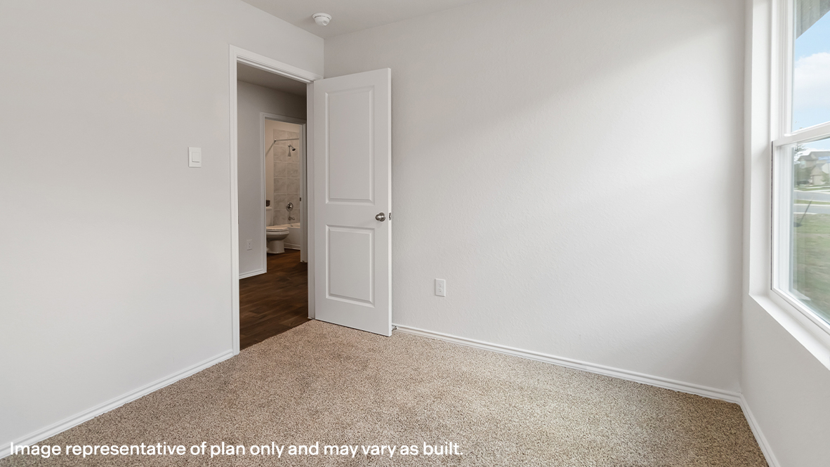 Atlanta secondary bedroom with carpeted flooring and window.