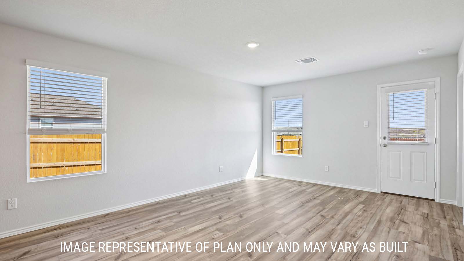 Atlanta living room with vinyl plank flooring and view of back door and back yard.