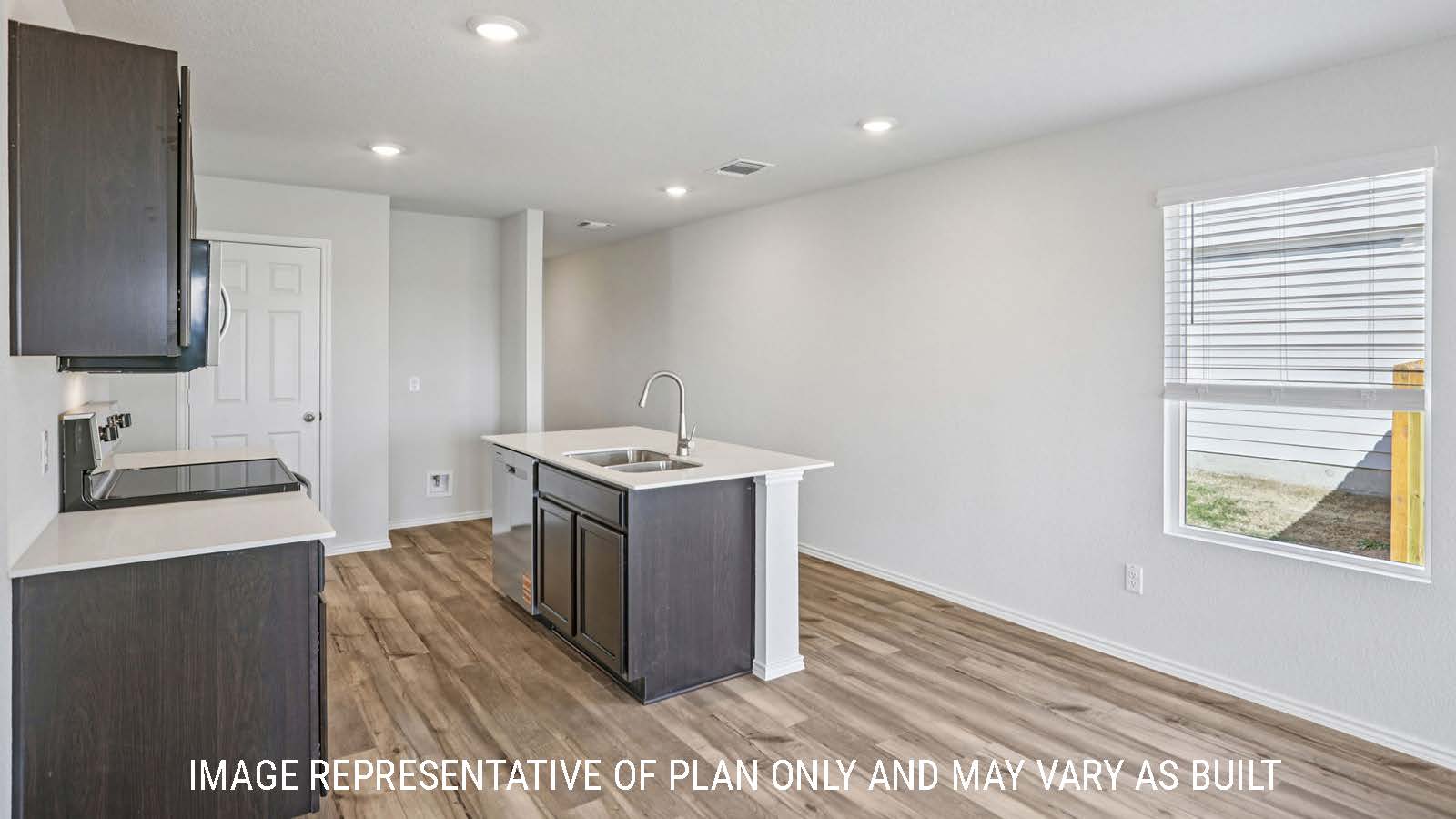 Atlanta kitchen with kitchen island with granite countertops and dark cabinets.